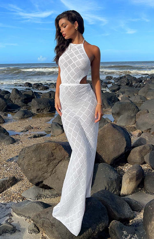White crochet maxi dress with cut out detailng on the side on brunette model