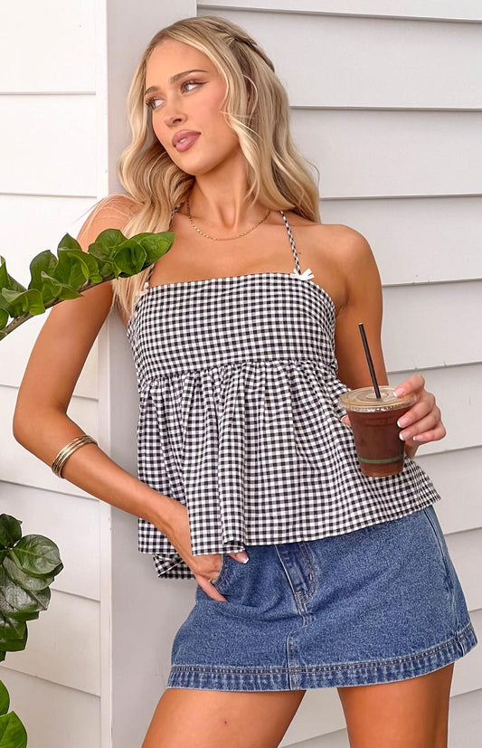 Black gingham halter top with bow detailing and tie up back, styled with a denim mini skirt