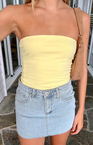 Beginning Boutique Siletto Star Light Wash Denim Low Rise Mini Skirt light wash denim low rise mini skirt with raw hem