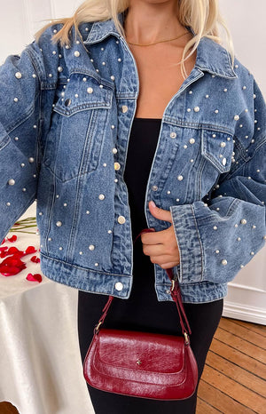 Beginning Boutique Denim Dazzle Pearl Mid Wash Denim Jacket mid wash denim jacket with pearl studs, classic collar, button front, and chest pockets