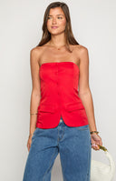 brunette girl wearing a red strapless longline top