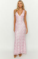 Pink lace floral maxi dress on brunette model holding a pink drink.