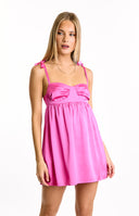 A radiant hot pink satin mini dress, designed with a ruched bust and sweet tie-shoulder straps, offering a playful and eye-catching look for a party or dance.