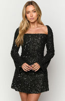 Black sequin long sleeve velvet mini dress on brunette model
