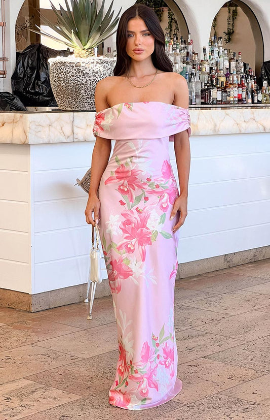 Pink floral strapless maxi dress worn by brunette model 